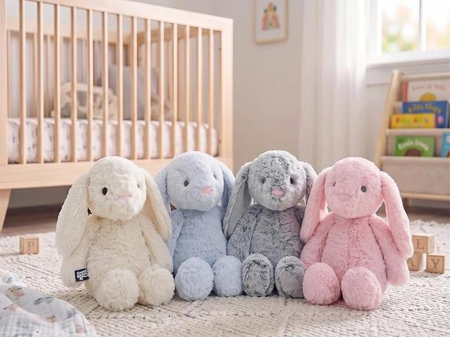Snuggle Buddies bunnies and a teddy bear on a nursery rug
